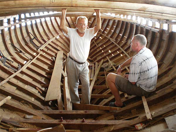 girard shows a novice carpenter the skill of boatbuilding